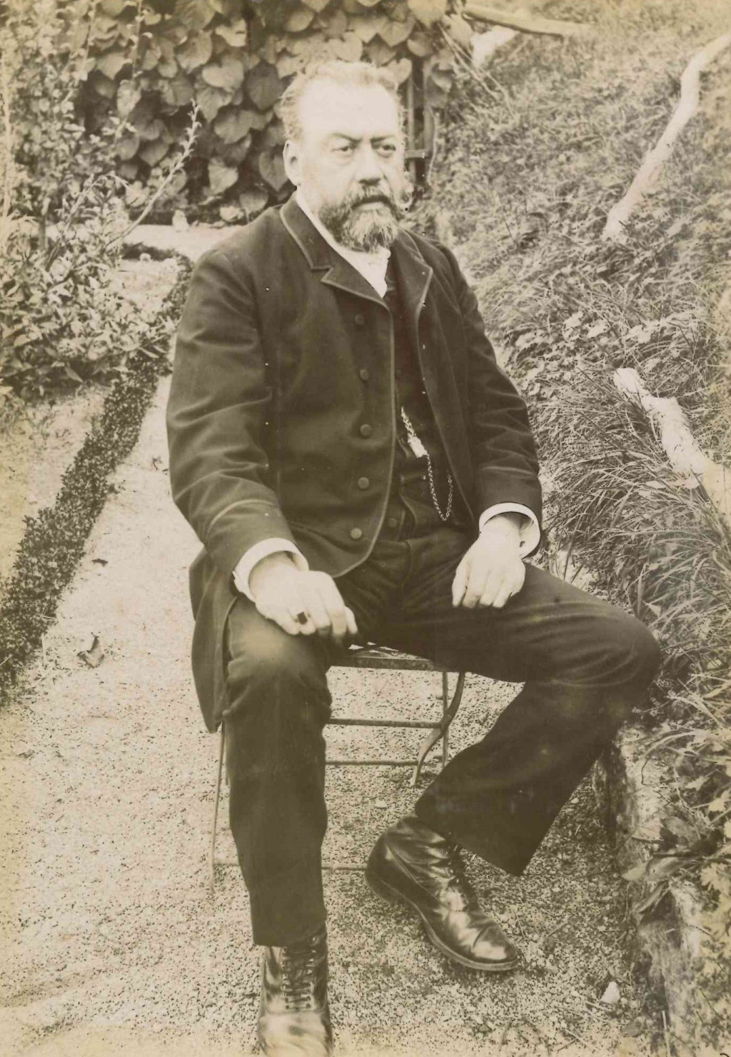 Photograph of Albert Boyer sitting in a garden
