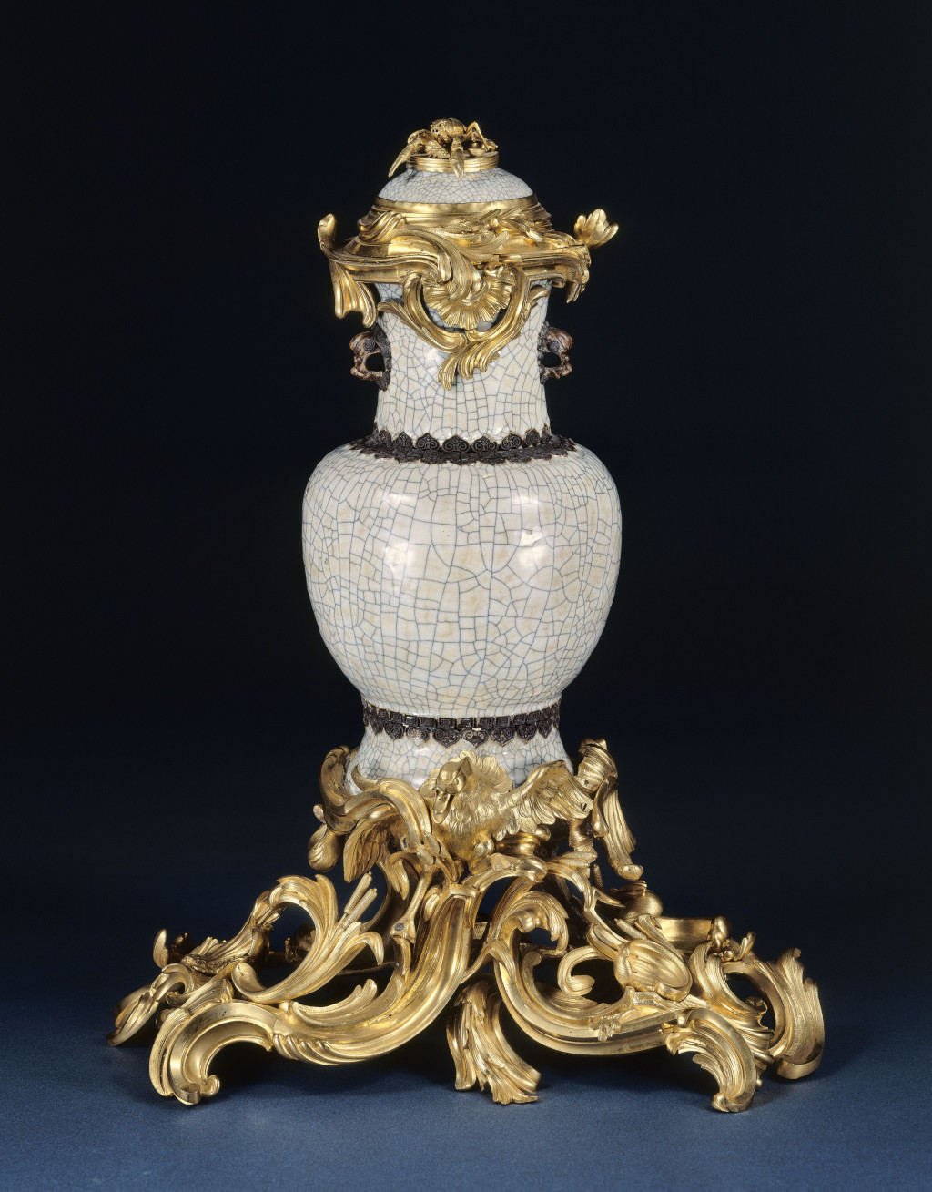 Photograph of a porcelain vase mounted in golden bronze